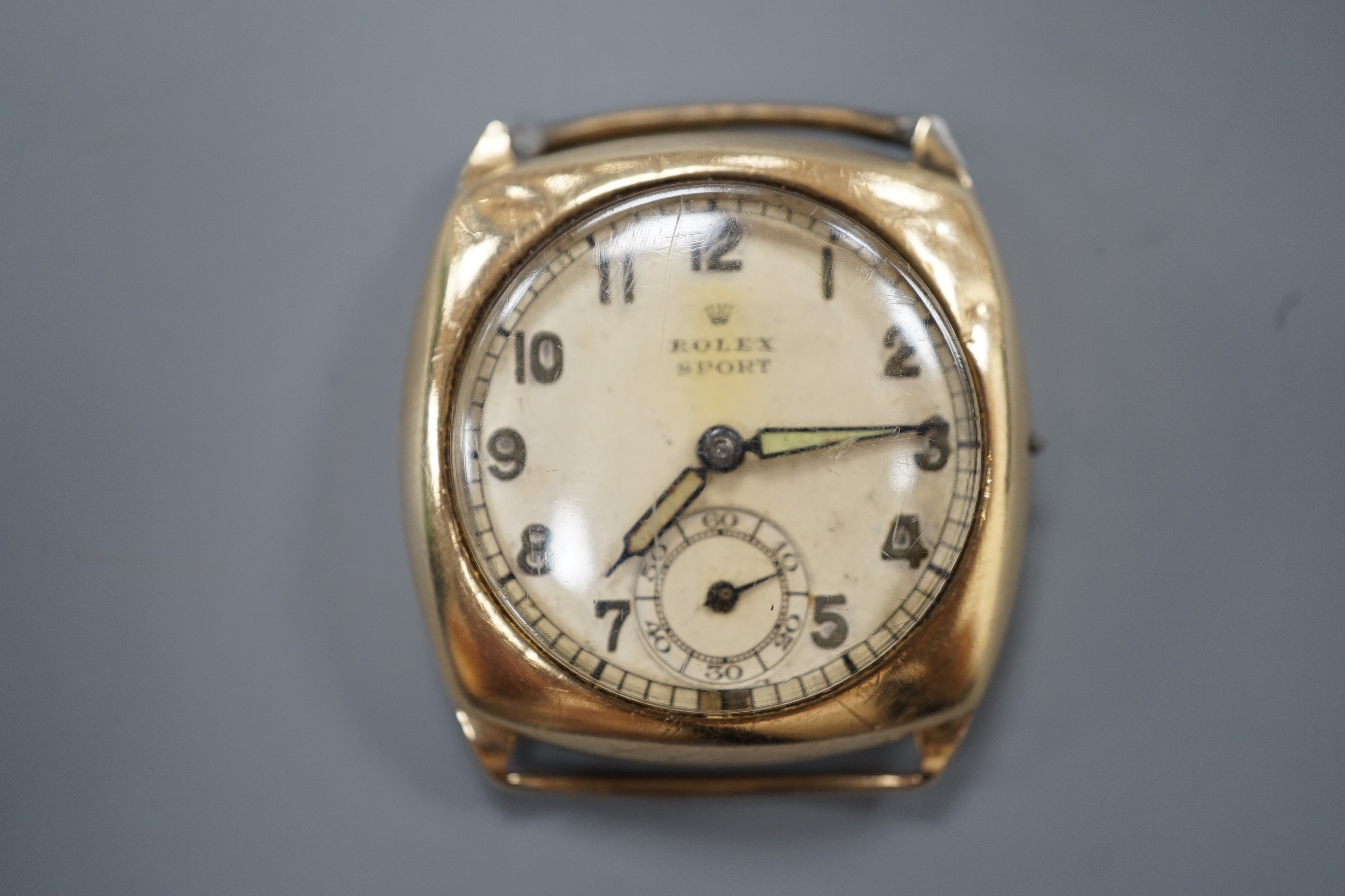 A gentleman's 1940's 9ct gold Rolex Sport manual wind wrist watch, with Arabic dial and subsidiary seconds, case diameter 30mm, lacking winding crown and strap, gross weight 16.7 grams.